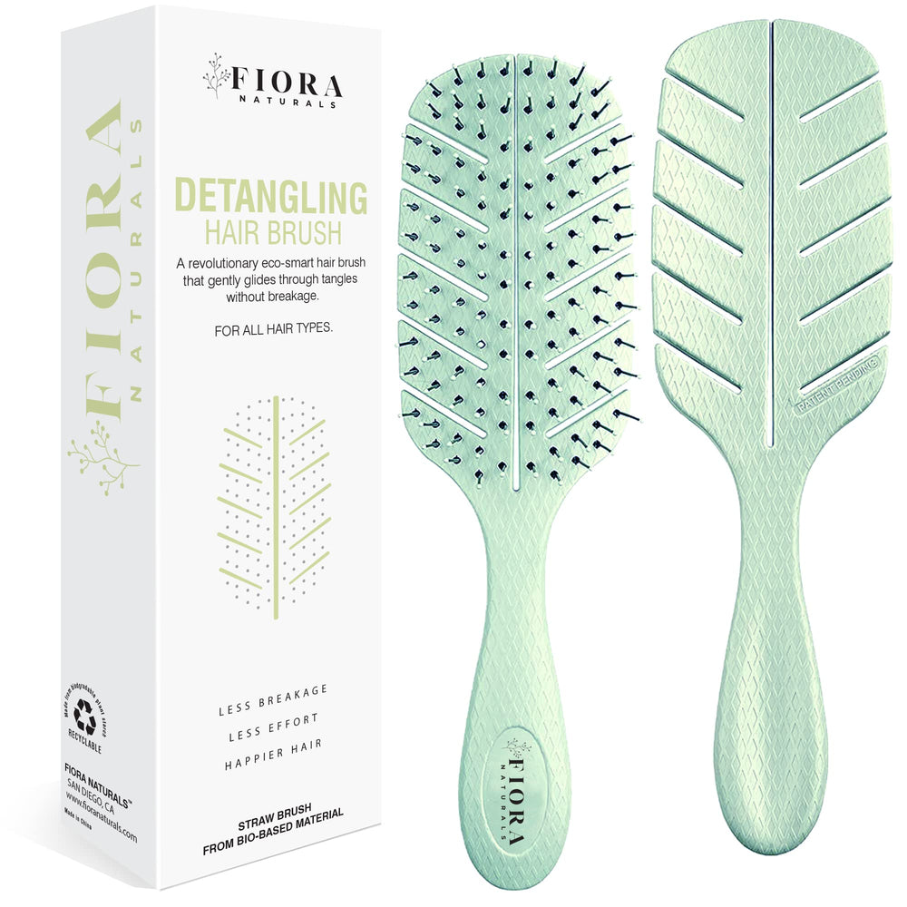 Fiora Naturals Detangler Brush front view demonstrating gentle detangling with no pull action for all hair types.
