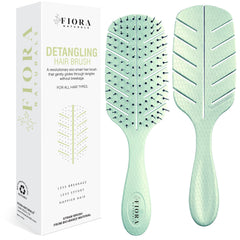 Fiora Naturals Detangler Brush front view demonstrating gentle detangling with no pull action for all hair types.