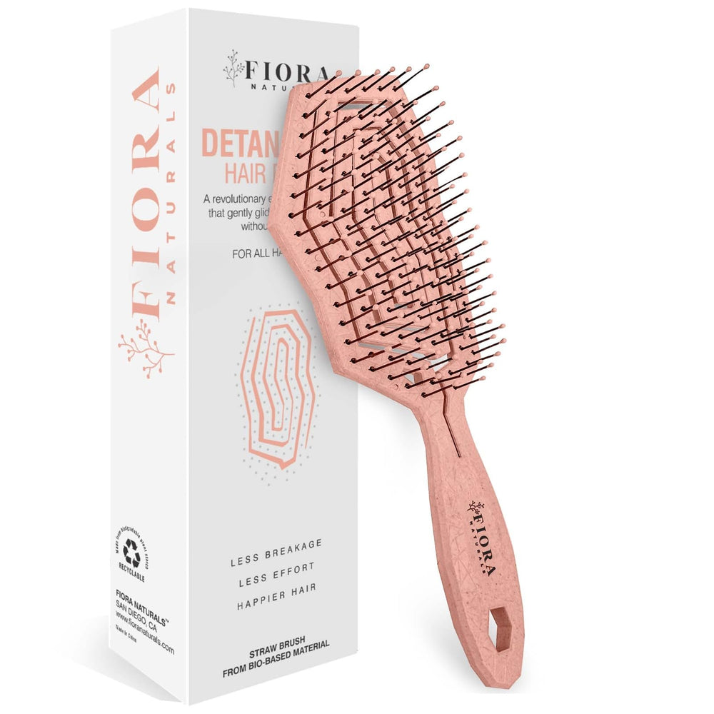 Fiora Naturals hair detangling brush closeup showing ultra-soft bristles for gentle detangling.