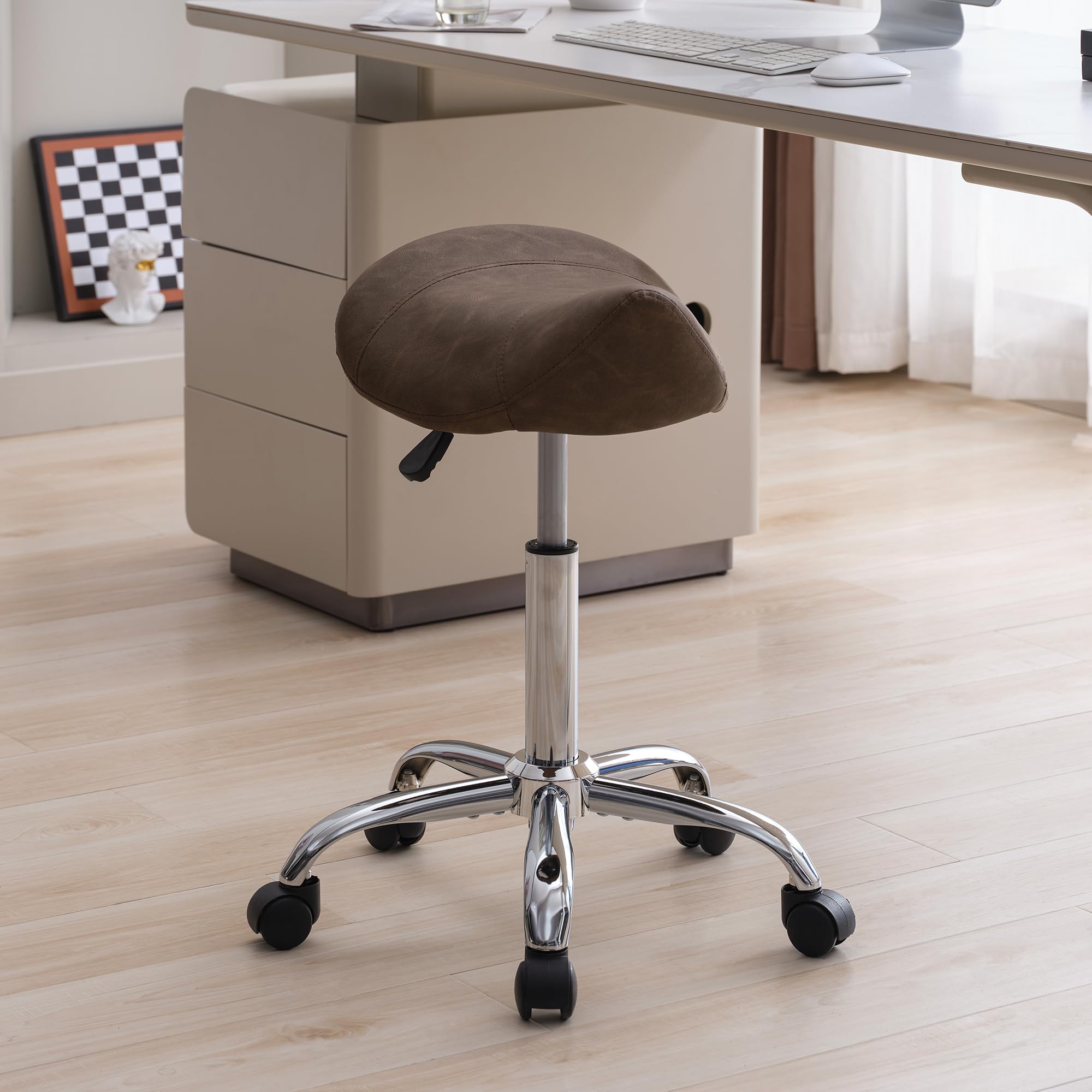 FIRAVOE Saddle Stool demonstrates adjustable height for personalized comfort