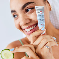 First Aid Beauty Hydrating Eye Cream applying to under-eye area for smoother look