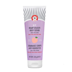 First Aid Beauty KP Bump Eraser bottle close-up showing peach scent for smoother skin.