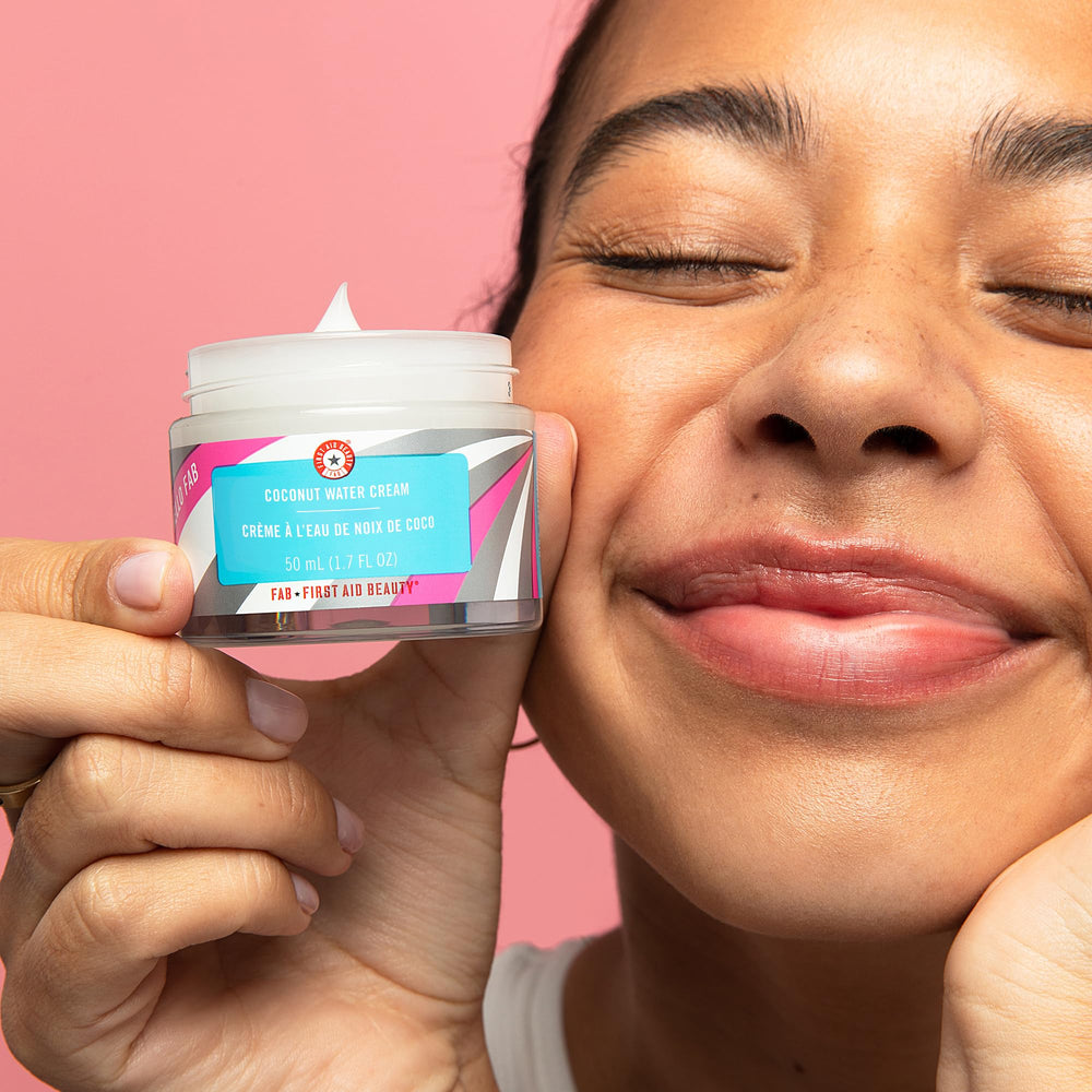First Aid Beauty Coconut Water Cream jar close-up highlighting smooth texture