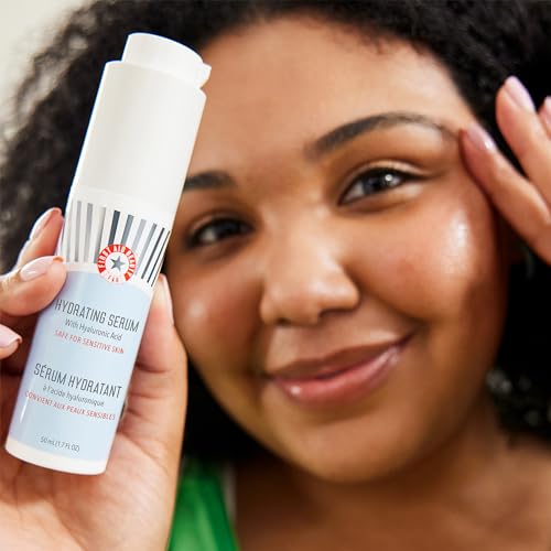 First Aid Beauty serum applied to the skin for a dewy, plump look.