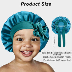 FIRSTPELLA kids silk bonnet black-band wear demonstrates secure fit.