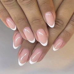 FJSMTOPl French Tip press-on nails in short oval shape for quick chic manicure.