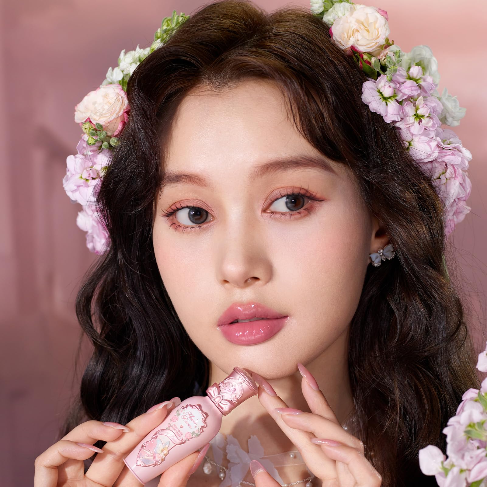 Flower Knows G05 Freesia swatch on skin highlights candy-pink shade.