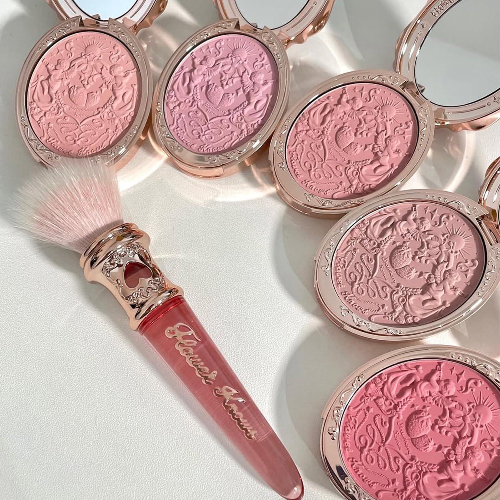 Flower Knows gifting-ready embossed blush box enhances vanity display.