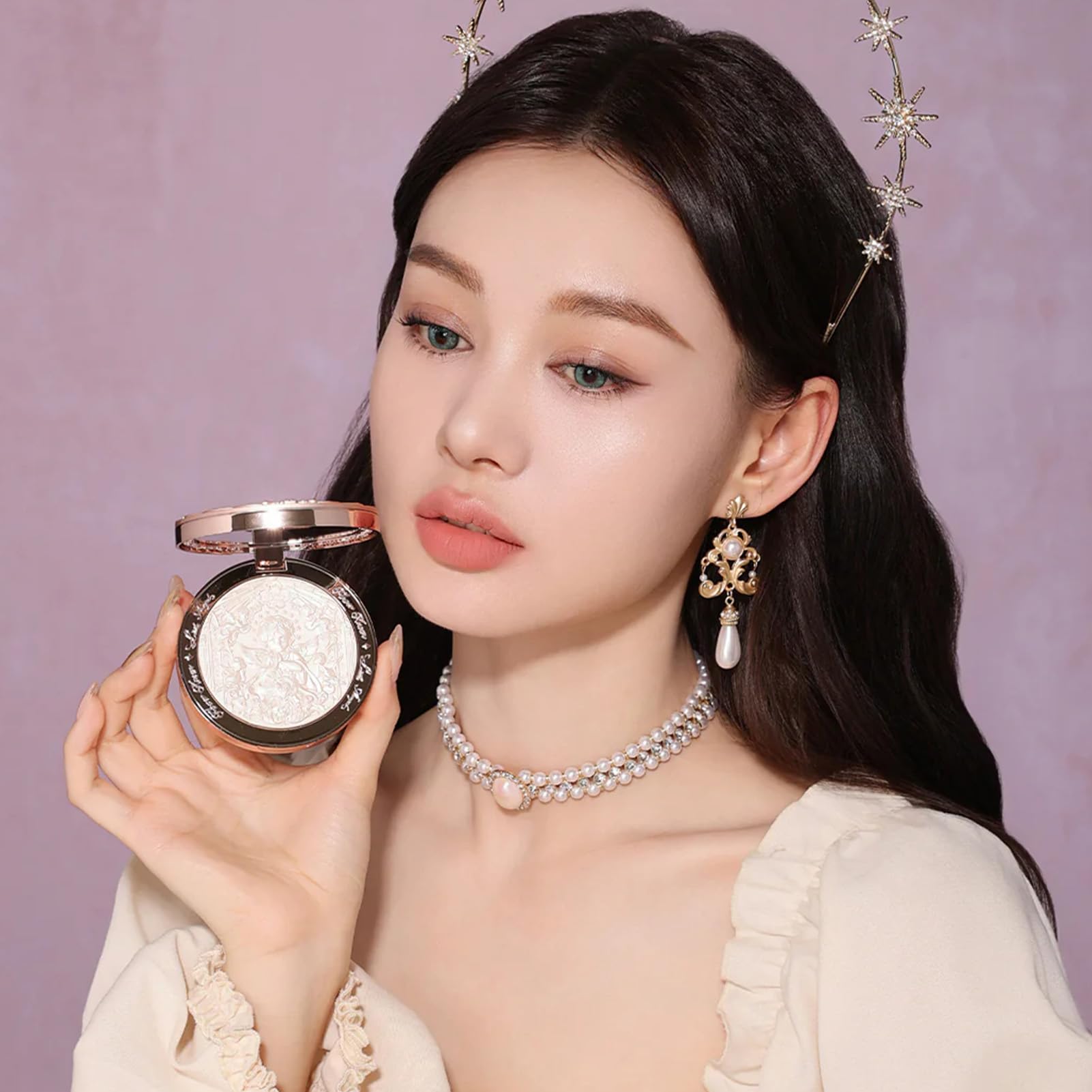 Flower Knows Little Angel embossed highlighter moonlight glow on skin.