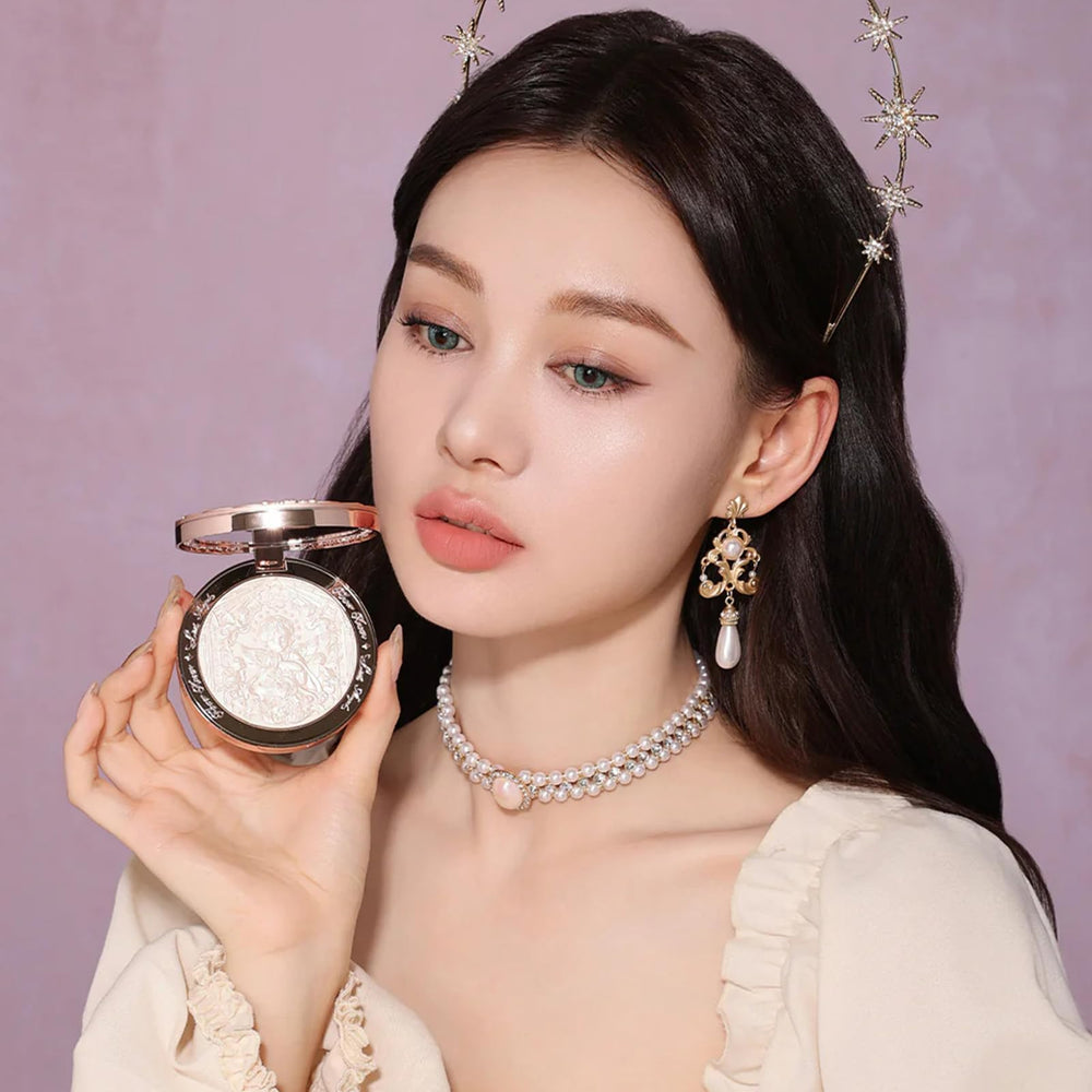 Flower Knows Little Angel embossed highlighter moonlight glow on skin.
