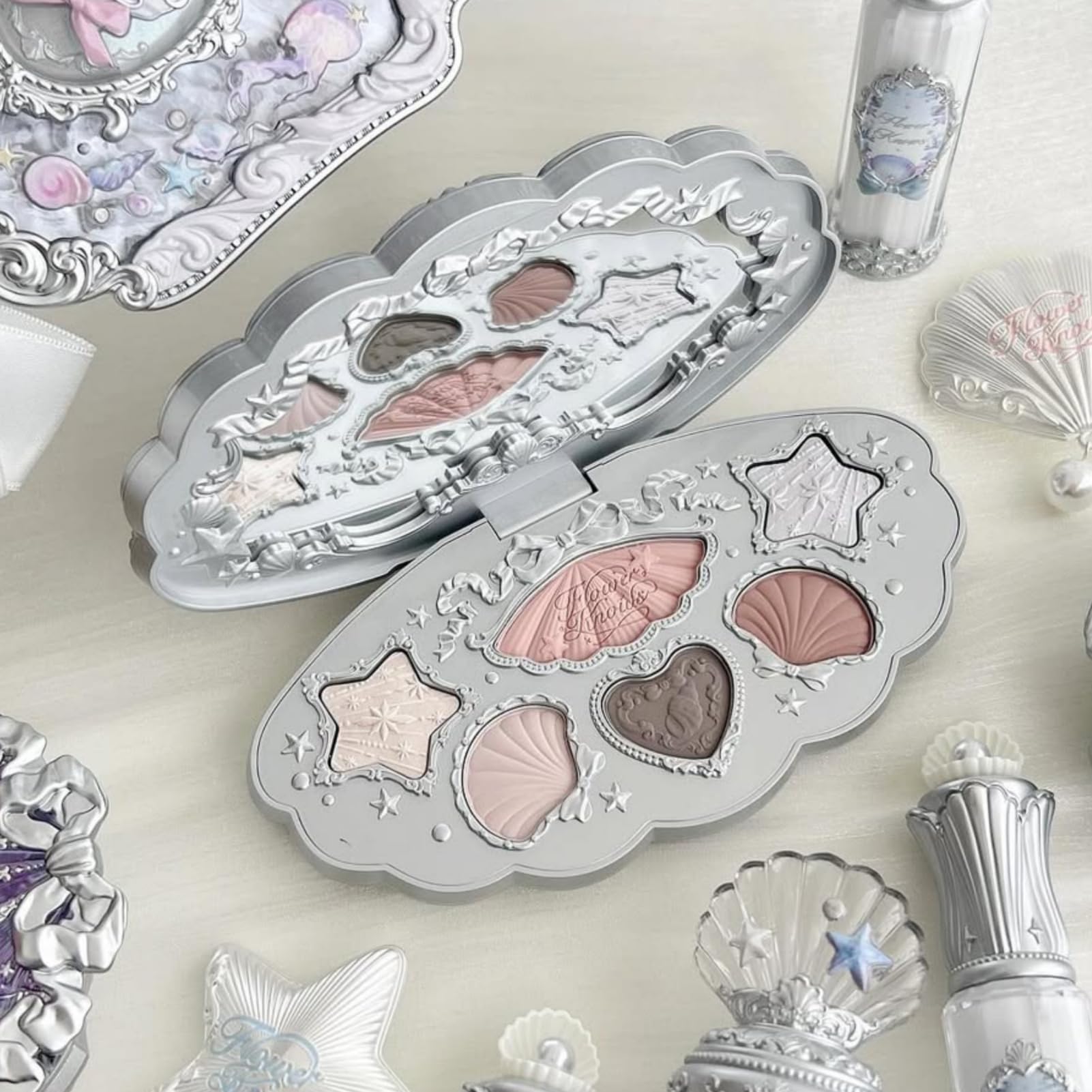 Flower Knows Shell's Jewel shimmer shades add light-reflecting glow without heaviness.