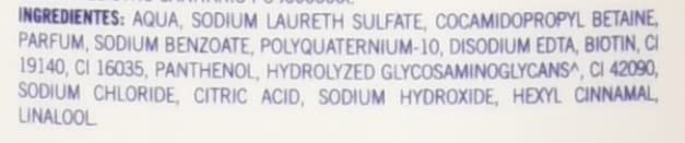 Folicure Shampoo label closeup detailing usage and benefits