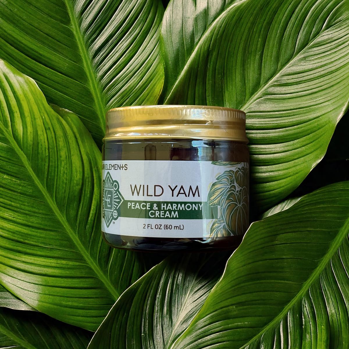 Four Elements Peace & Harmony cream on skin for soothing topical use.