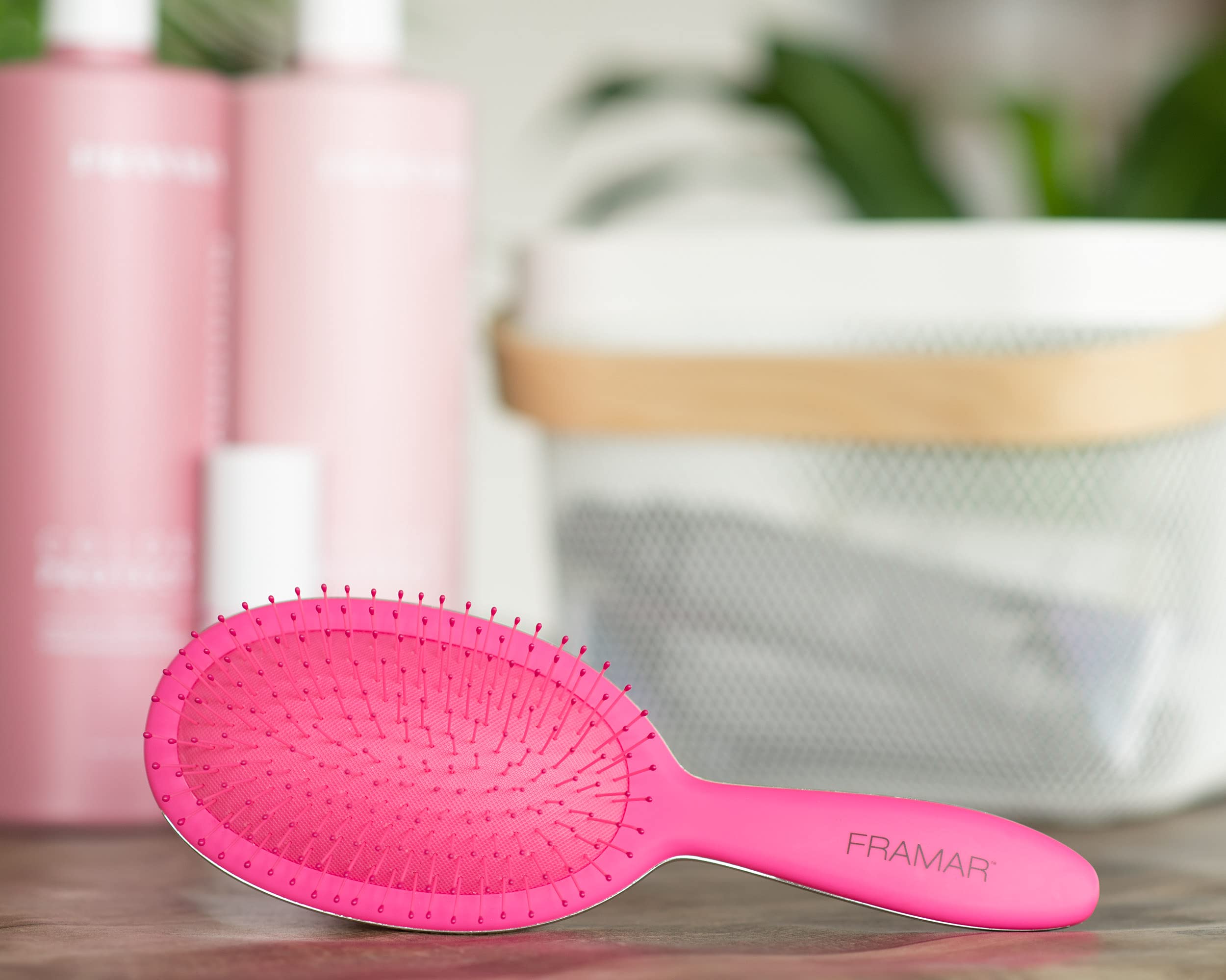 FRAMAR detangling brush elegant-pink-color showcases stylish design for vanity and travel.