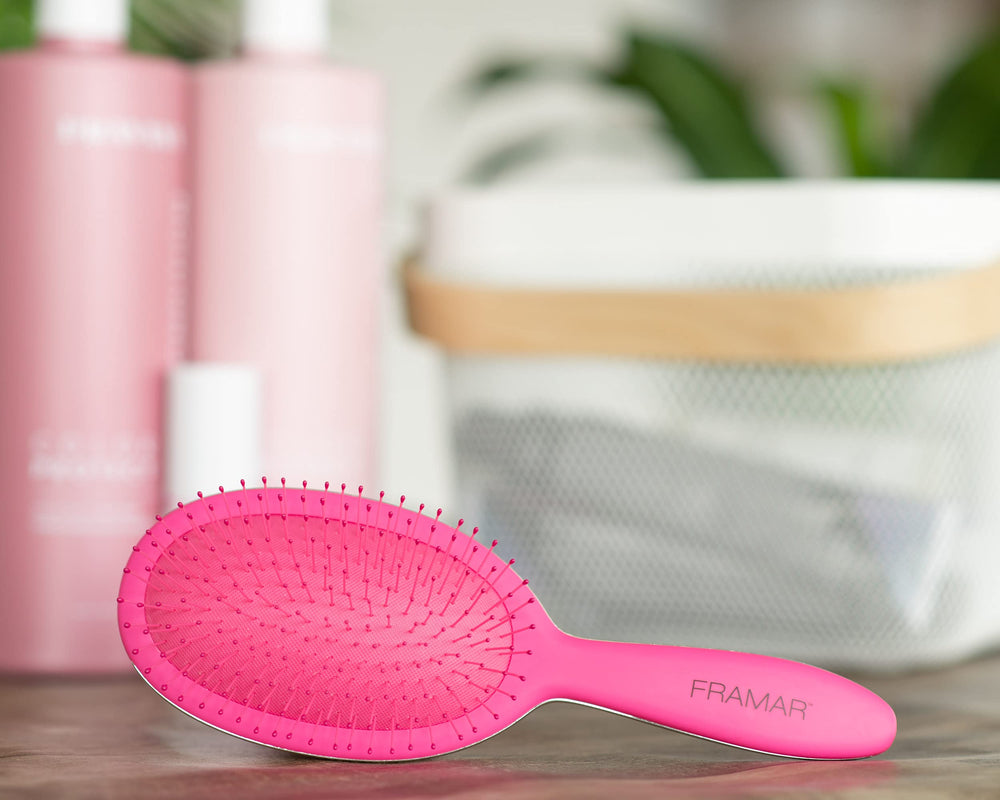 FRAMAR detangling brush elegant-pink-color showcases stylish design for vanity and travel.