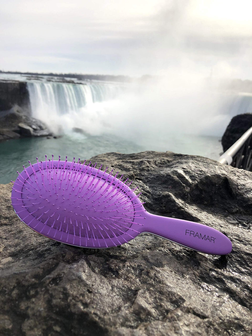 FRAMAR Detangling Brush purple design highlighting color and style options.