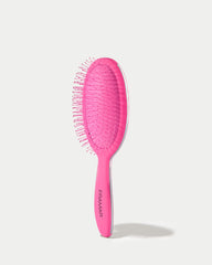 FRAMAR detangling brush flexible-bristles closeup shows painless knot removal.