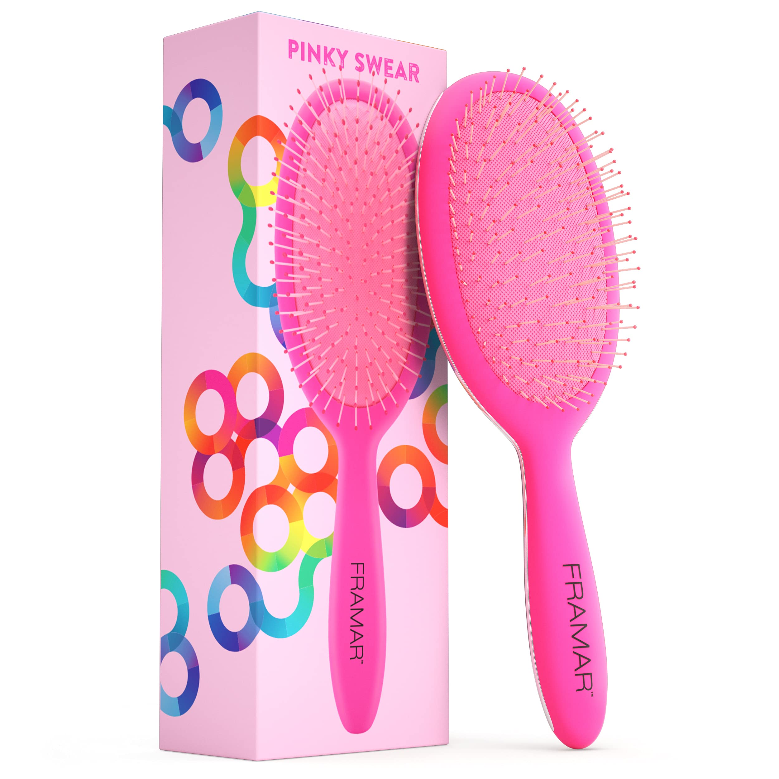 FRAMAR detangling brush pink-handle closeup for gentle detangling on wet or dry hair.