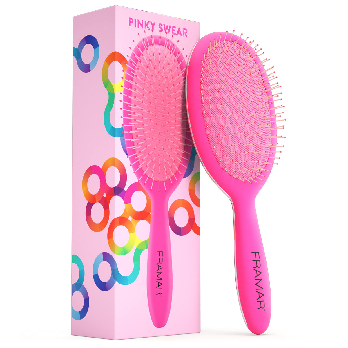 FRAMAR detangling brush pink-handle closeup for gentle detangling on wet or dry hair.