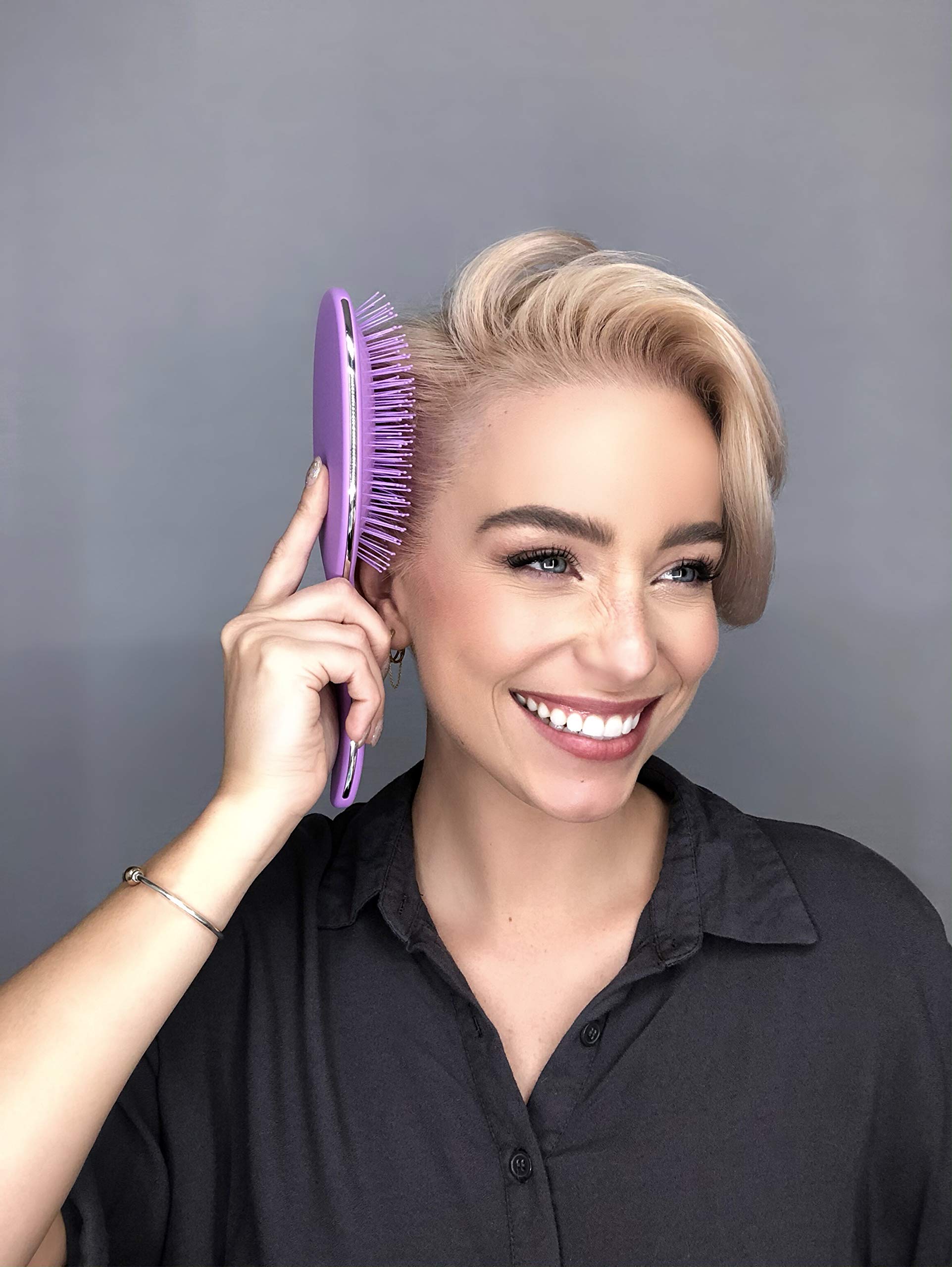 FRAMAR Detangling Brush used on wet hair to detangle without damage.