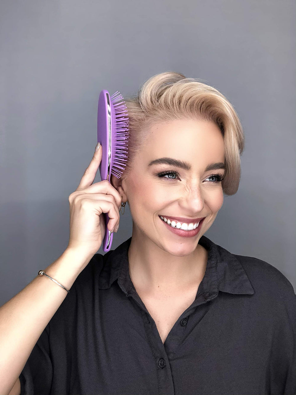 FRAMAR Detangling Brush used on wet hair to detangle without damage.
