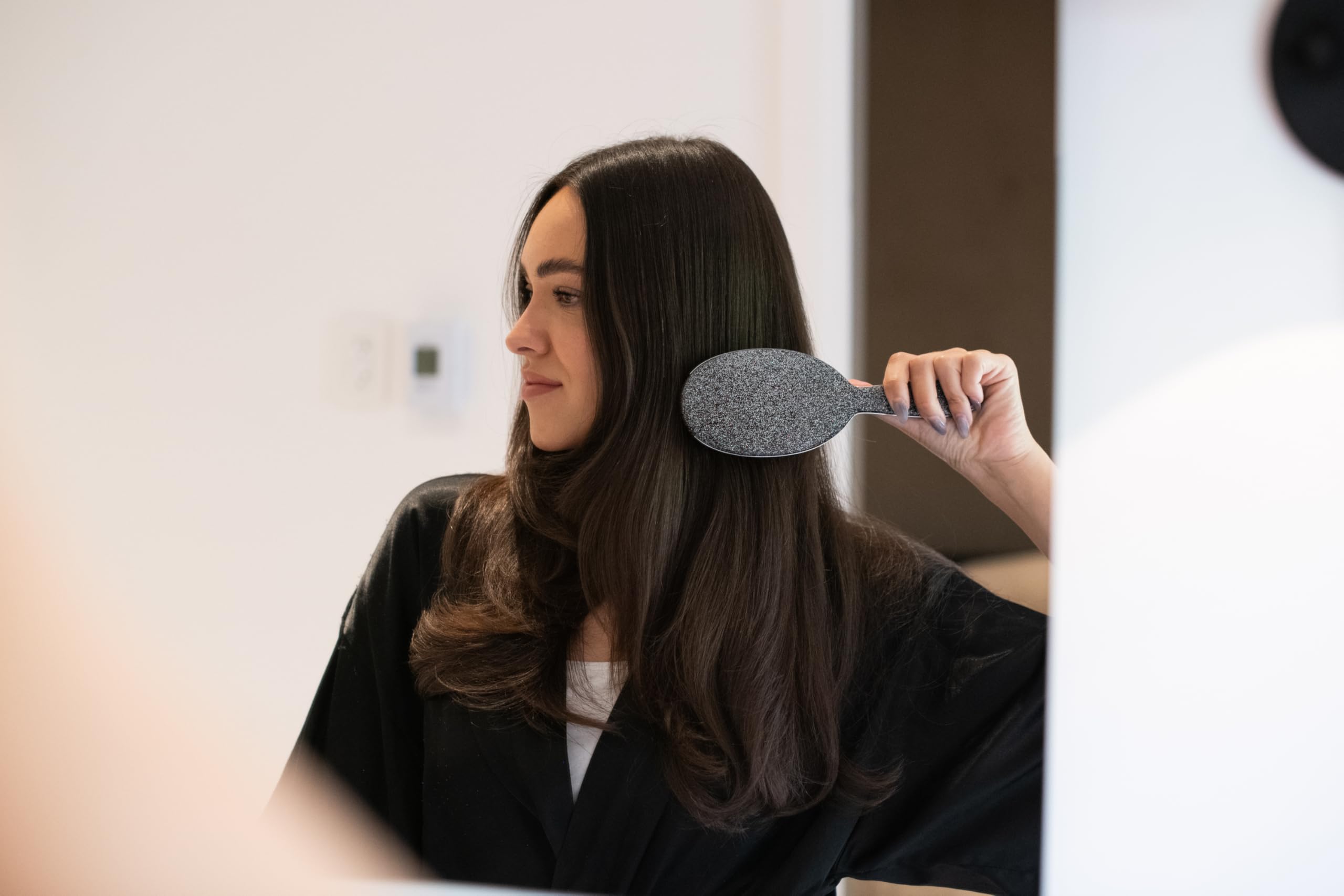 FRAMAR Glitter Hair Brush Detangler in use on wet hair demonstrates gentle detangling.