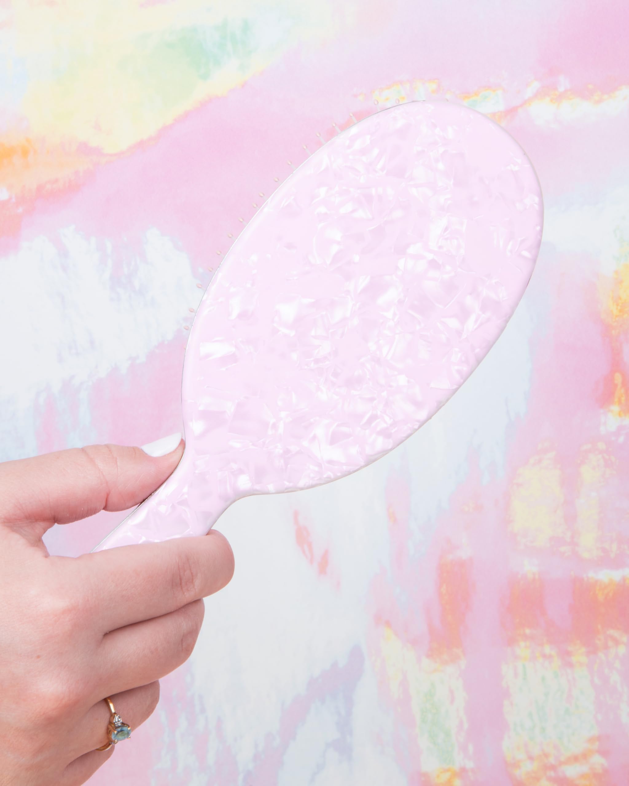 FRAMAR Iridescent Wet Hair Brush glamorous iridescent surface adds style to routine.