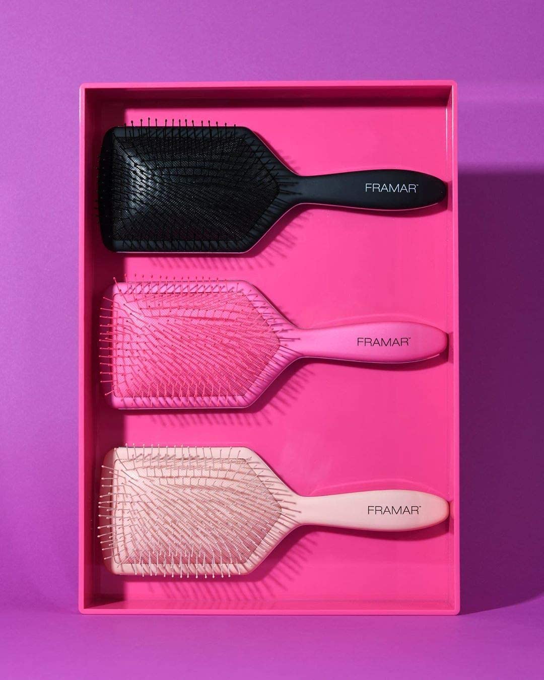 FRAMAR paddle-brush-morning-routine pink speeds detangling for quicker styling.