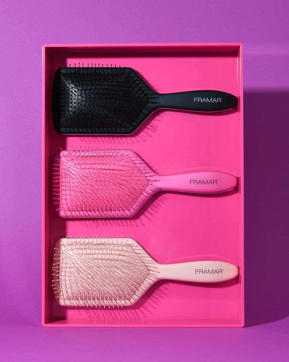 FRAMAR paddle-brush-morning-routine pink speeds detangling for quicker styling.