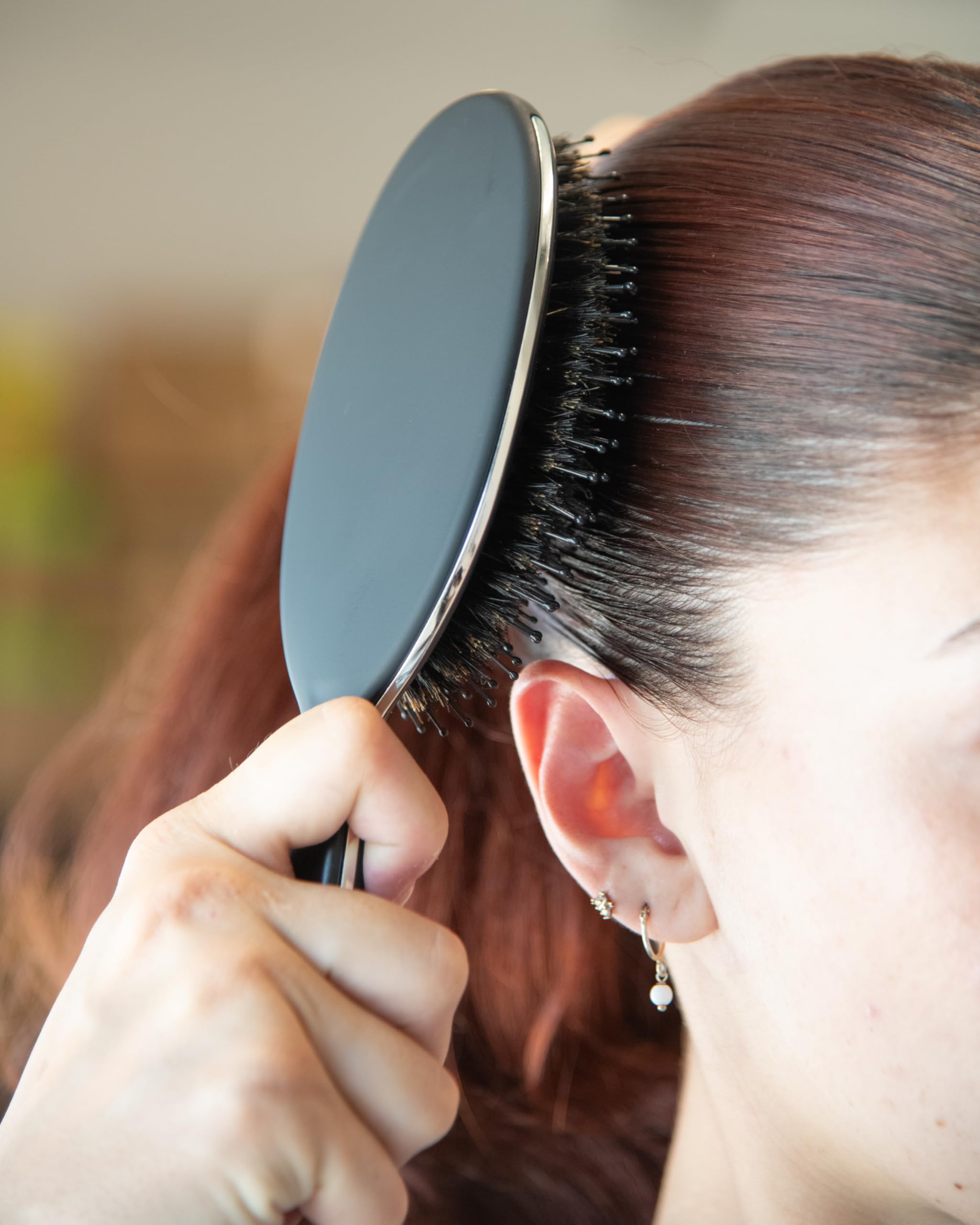 FRAMAR Soft Boar Bristle Hair Brush hair section view highlighting gentle detangling.