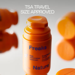 Freaks of Nature Peak Performance SPF50 on beach-ready scene highlights 80-minute water resistance.