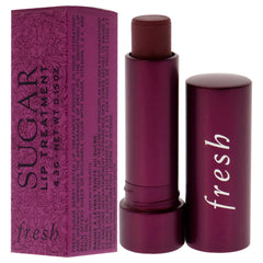 Fresh Sugar Lip Treatment Berry swatches on lips illustrate sheer buildable color