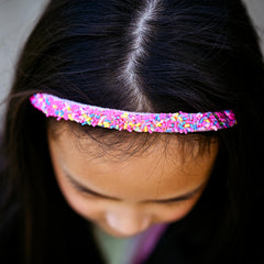 FROG SAC blue sequin headband provides non-slip shine during active play.