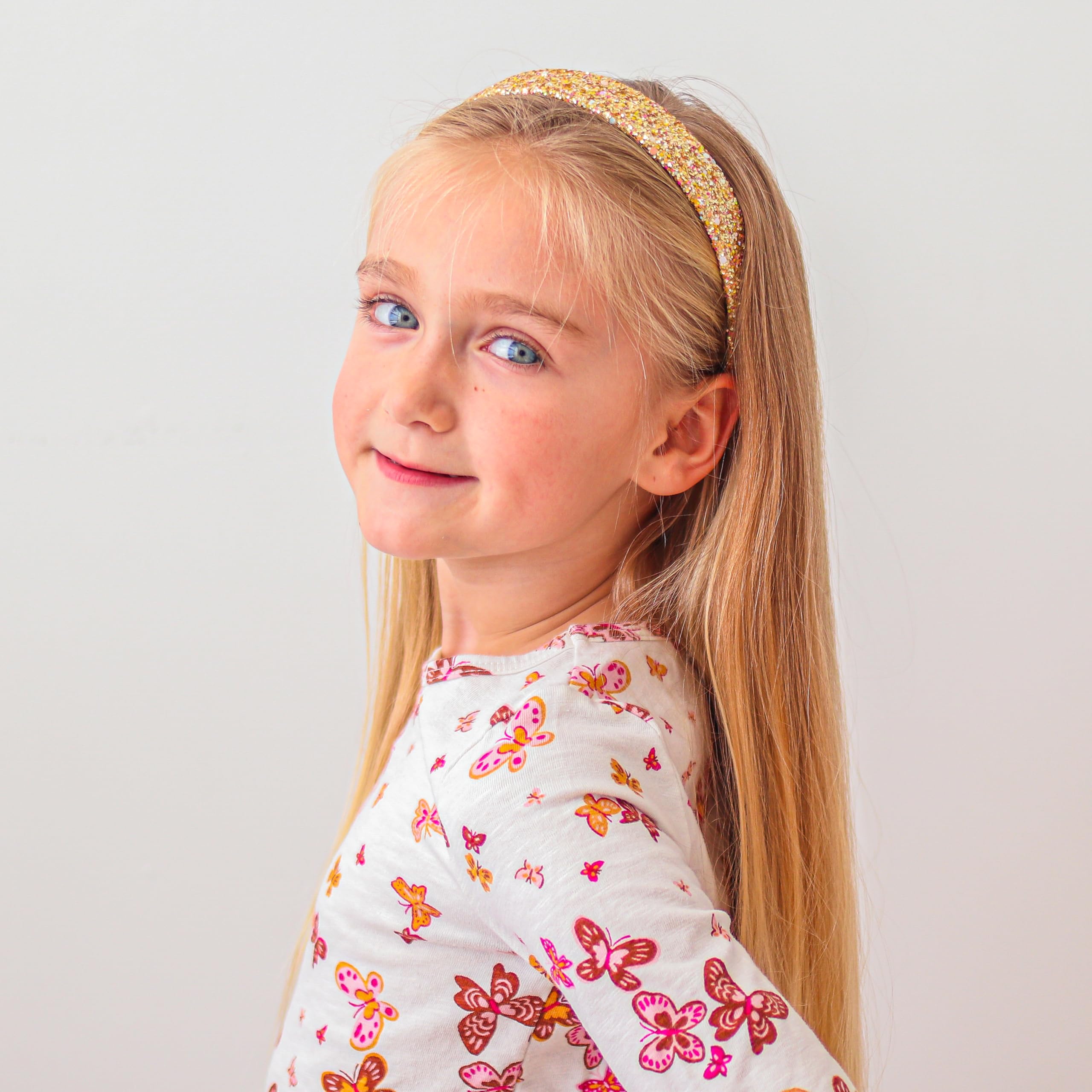 FROG SAC glitter headbands photographed at a birthday party for festive flair.