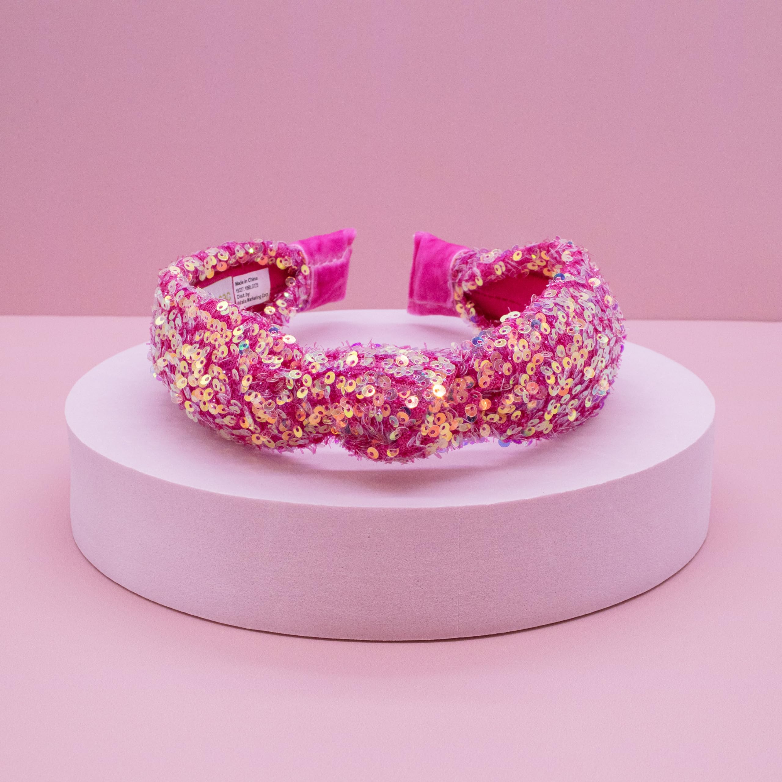 FROG SAC headband with iridescent sequins keeps hair tidy during school or play.