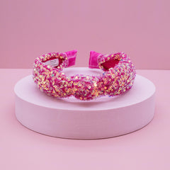 FROG SAC headband with iridescent sequins keeps hair tidy during school or play.