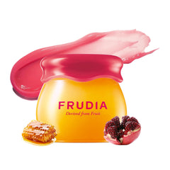 FRUDIA Pomegranate Honey Lip Balm tube close-up with glossy hydration