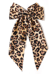 Furling Pompoms leopard hair bow camel front view showcases bold style and secure hold.