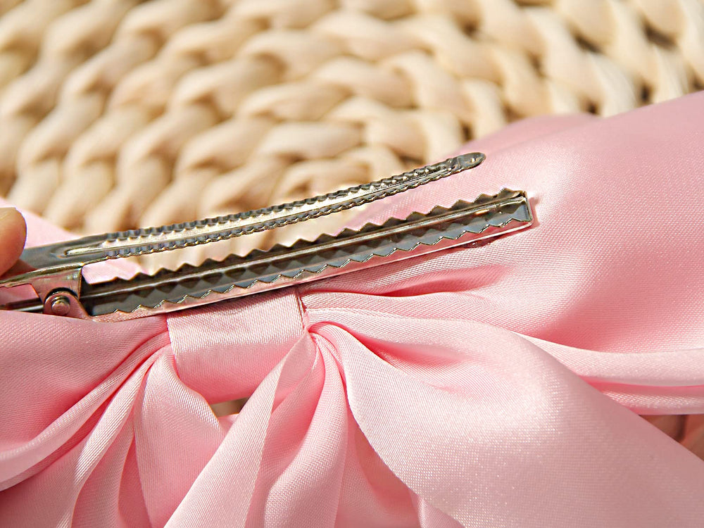 Furling Pompoms secure-grip clip keeps thick hair in place during events