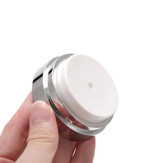 Furnido airless-pump-jar-dispense-action shows clean, mess-free dispensing.