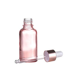 Furnido pink glass dropper bottle with rose-golden cap detail for premium use