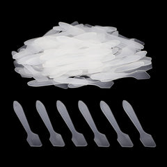 G2PLUS clear plastic cosmetic spatula showing hygienic, mess-free application.