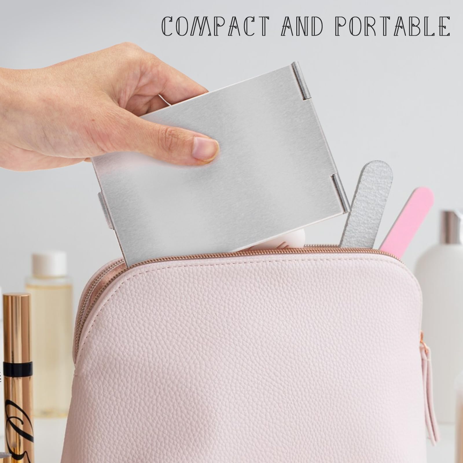 G2PLUS compact travel mirror held in hand showing portability