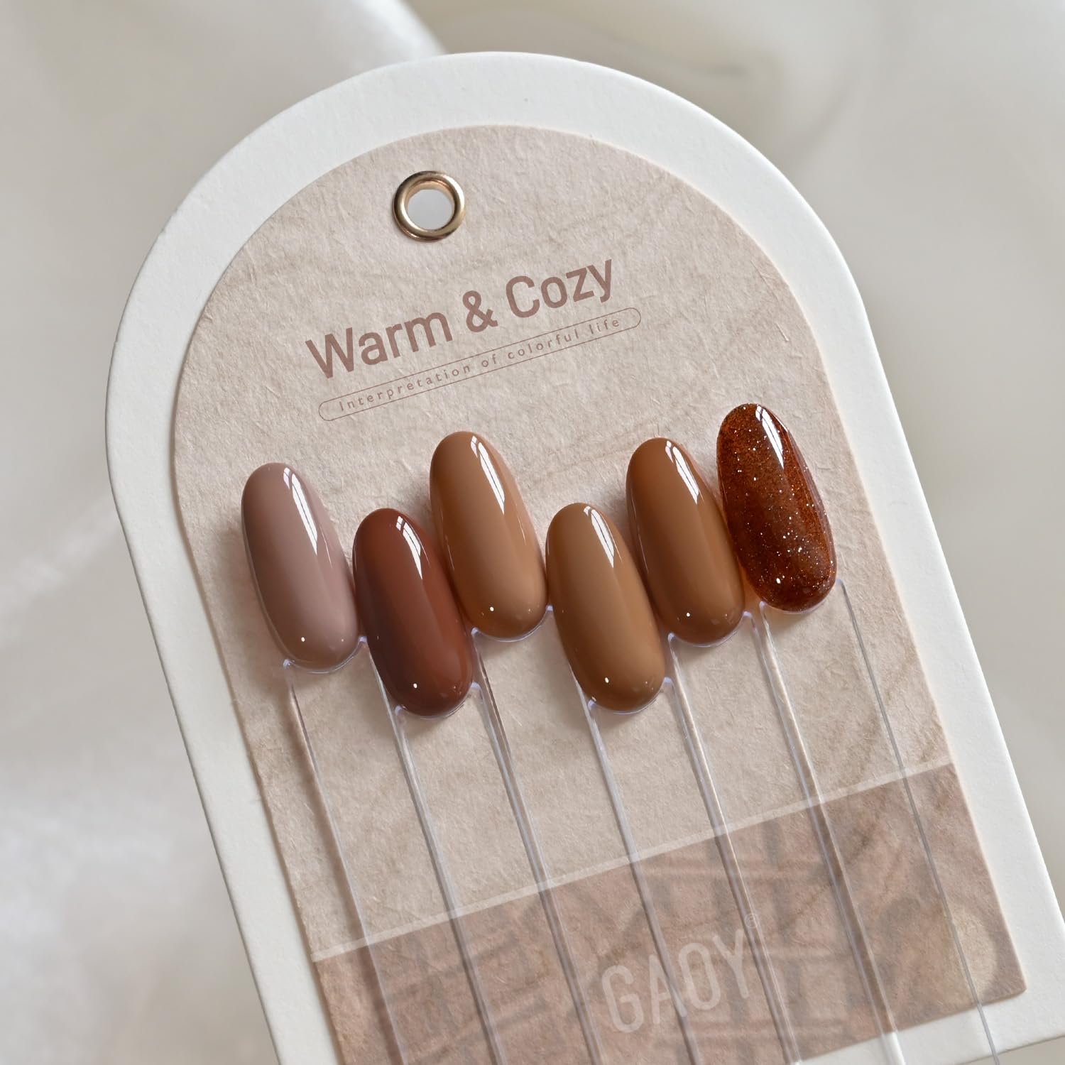 GAOY Hazelnut Chocolate gel polish curing under UV/LED lamp for quick results.