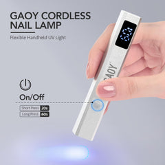 GAOY mini handheld UV light with LCD display for on-the-go nail curing.