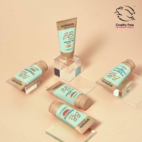 Garnier Miracle Skin Perfector swatch on medium skin tone for even complexion.