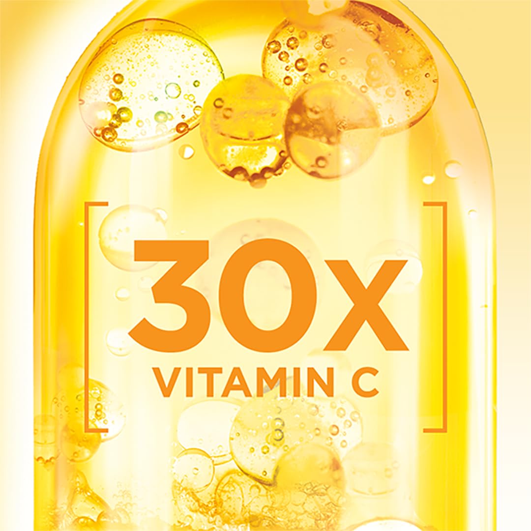 Garnier Bright Complete Vitamin C Booster bottle on a mirror during routine prep