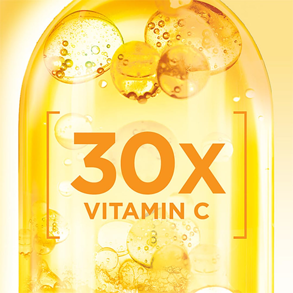 Garnier Bright Complete Vitamin C Booster bottle on a mirror during routine prep