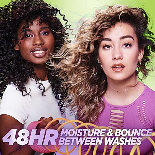 Garnier Fructis Curl Refresher spray being applied to hair