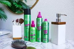 Garnier Fructis Root Amp bottle close-up highlights cotton flower extract for all-day lift.